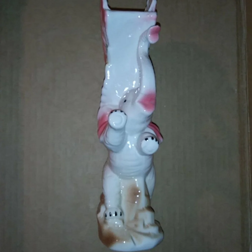 Vintage vase elephant with wings